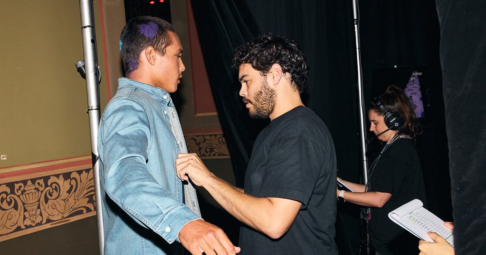 Nathan backstage fixing a model’s garment at Emerging MOB in Fashion, Melbourne Fashion Festival, 2024. Photo: Dan Castano