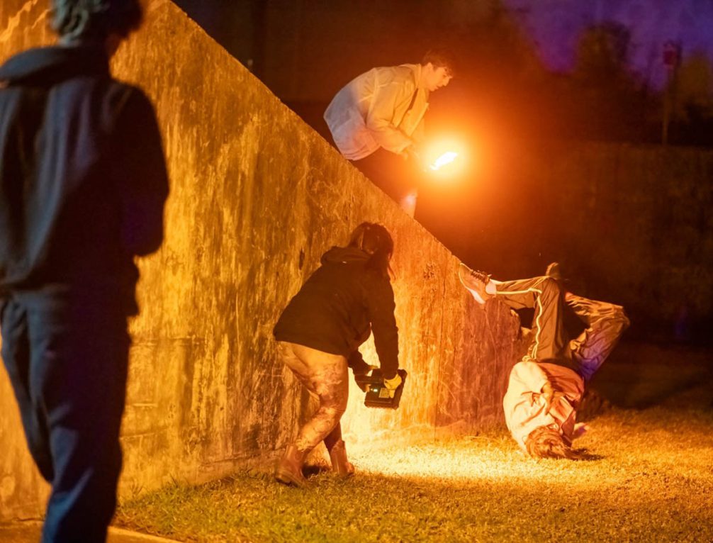 Dancers posing and being filmed before a concrete wall. Riana Head-Toussaint, Animate Loading 2, 2022-ongoing, Casula Powerhouse Arts Centre with performers Tom Kentta, Natalie Tso, Jeremy Lowrenčev and Bedelia Lowrenčev