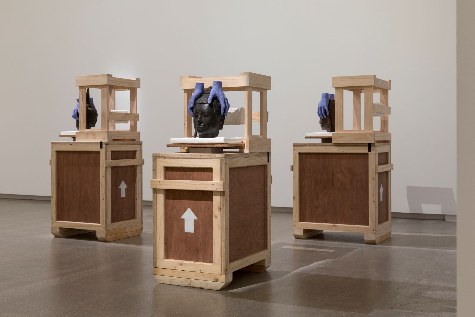 Three artworks in a gallery room