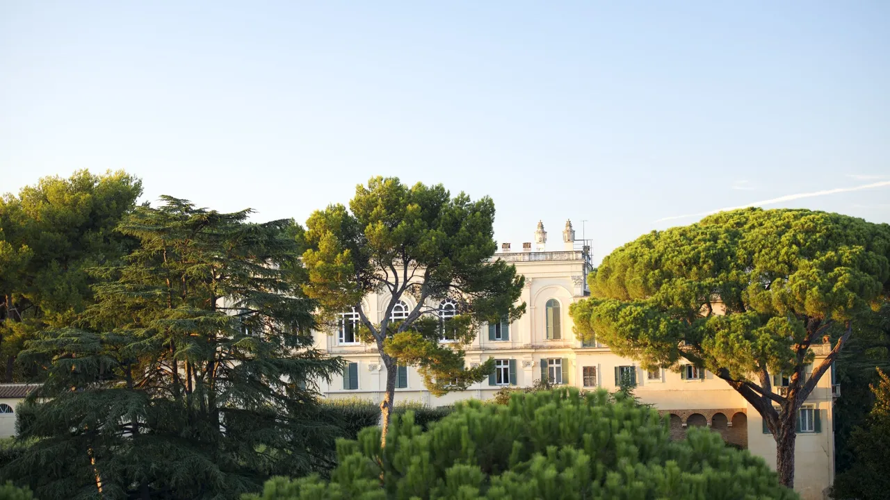  Caption: American Academy in Rome Studio window view looking across to Villa Aurelia Scholars Building from artists’ studio at the American Academy in Rome. Credit: Lynne Roberts-Goodwin.