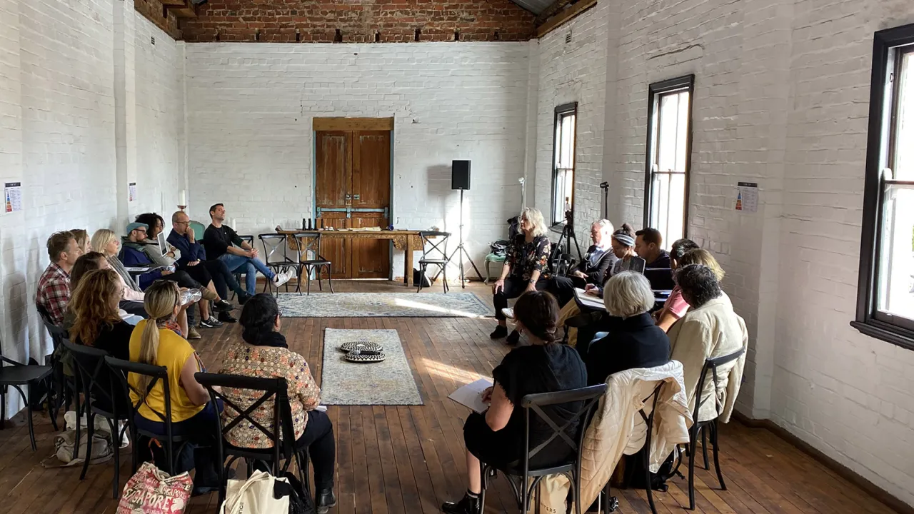 People sitting in a circle at a workshop
