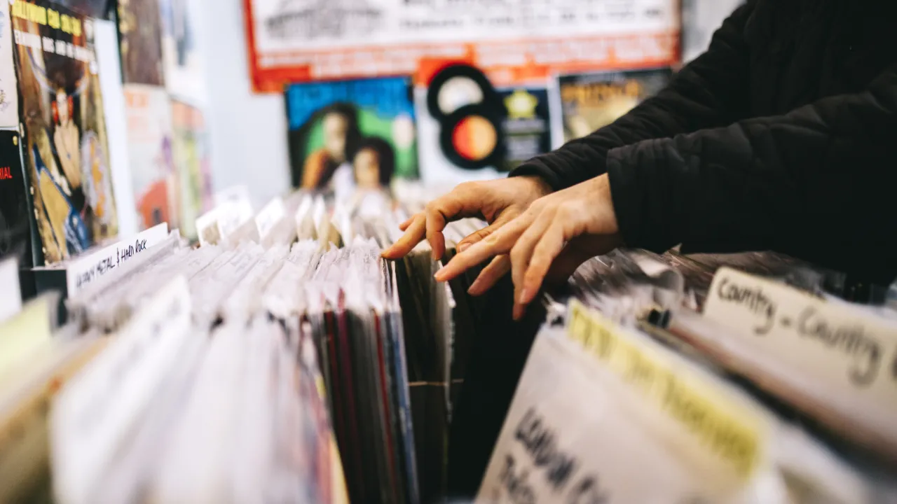 Person digging for vinyl in a record store