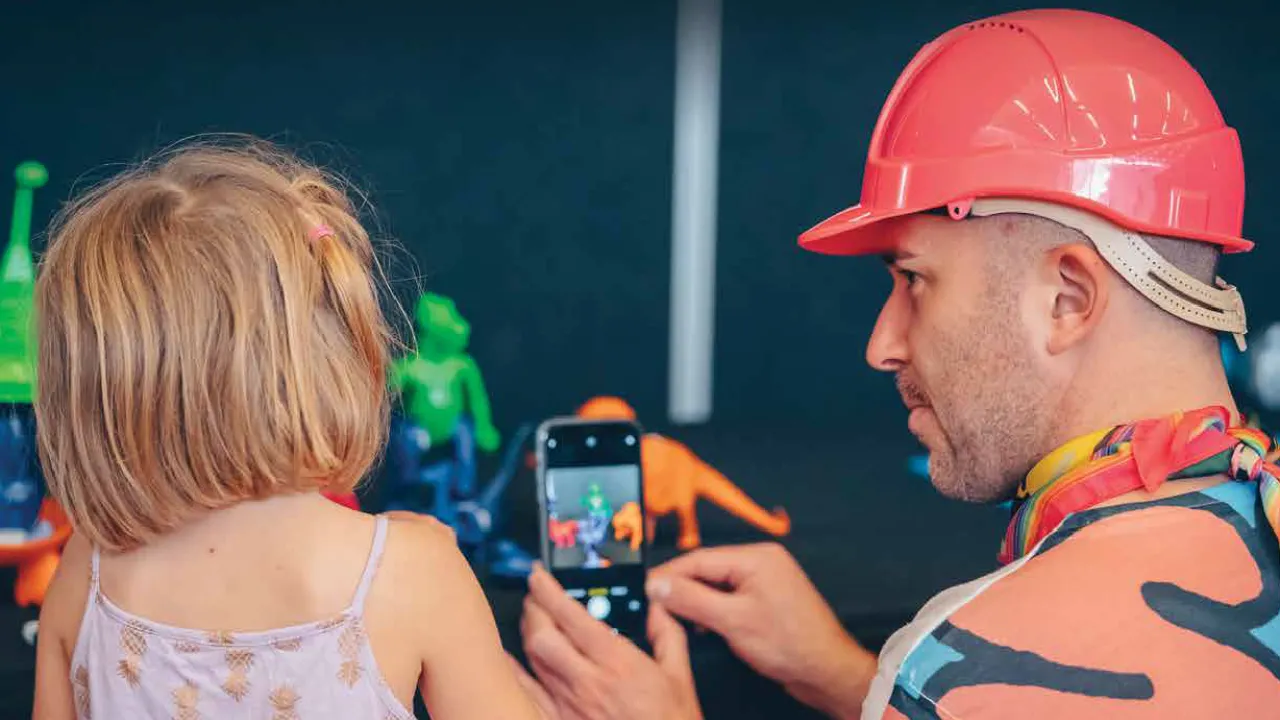 Child with a man in a hard hat