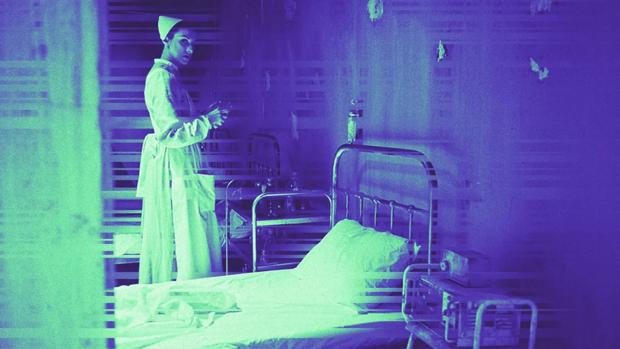 A performer dressed as a nurse stands in a decaying hospital room with peeling blue-green walls, iron beds and vintage medical equipment, from Broad Encounters’ immersive production A Midnight Visit.