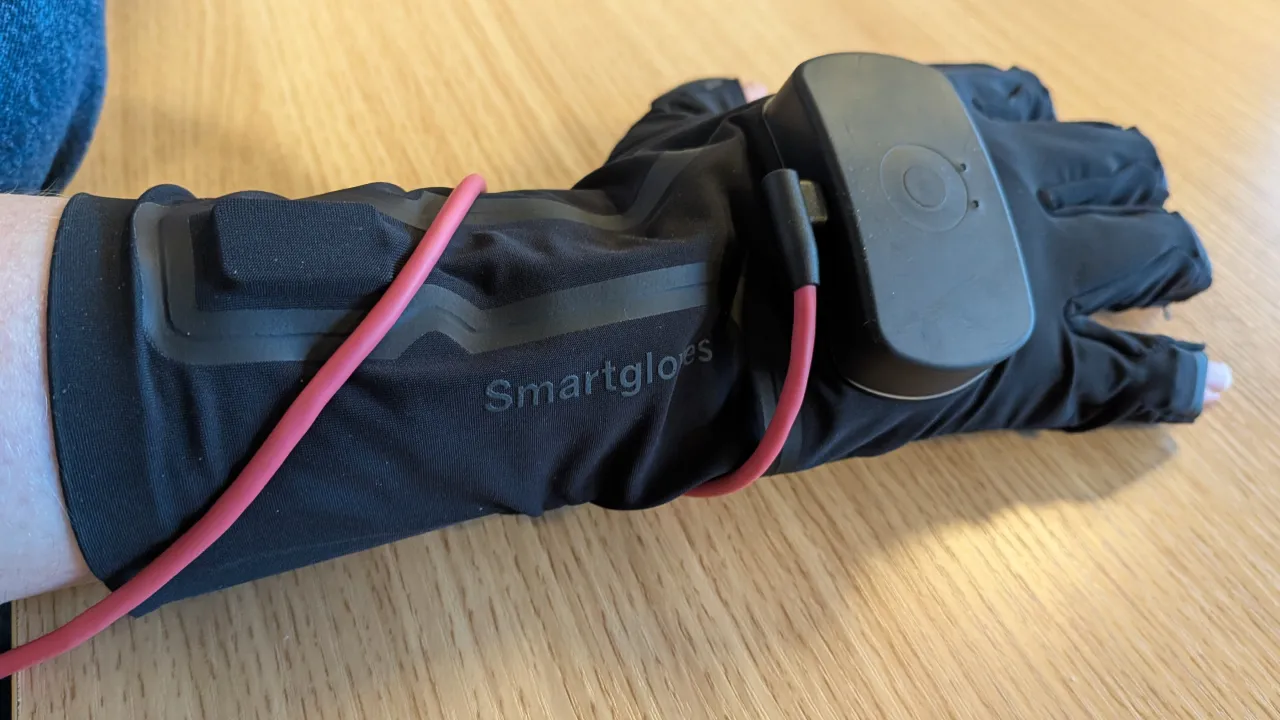 A photo of a hand wearing a glove used for 3D motion capture.