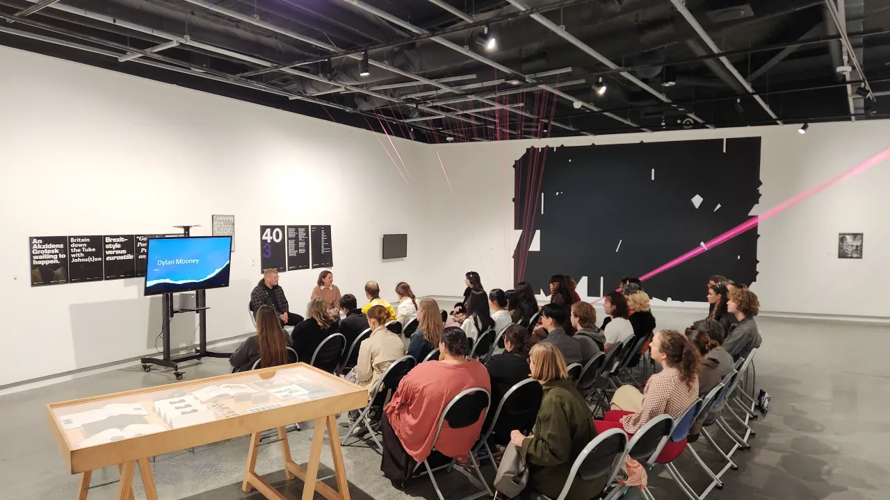 Image of attendees listening to Dylan Mooney and Carrie McCarthy. 