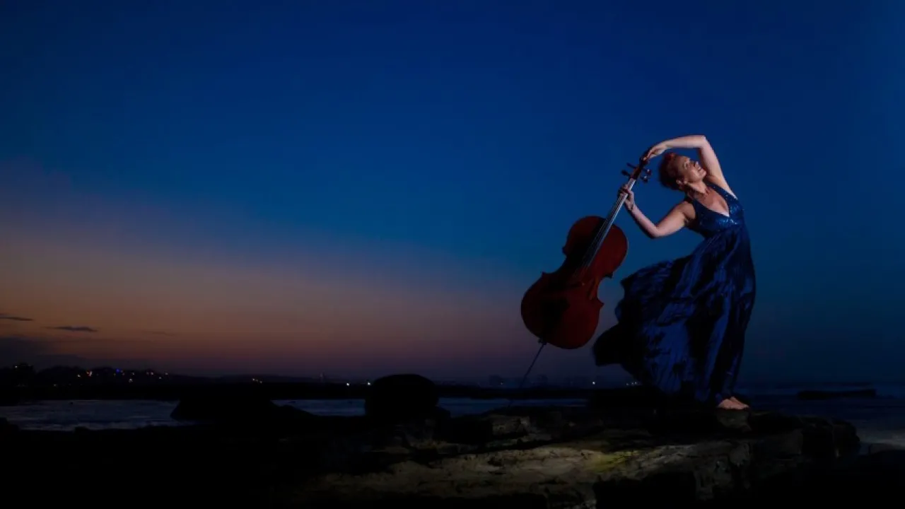 Louise King Cello Dreaming on the beach at sunset 