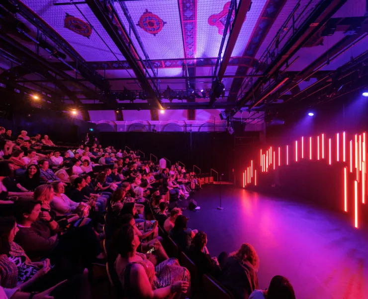 audience sitting in a theatre