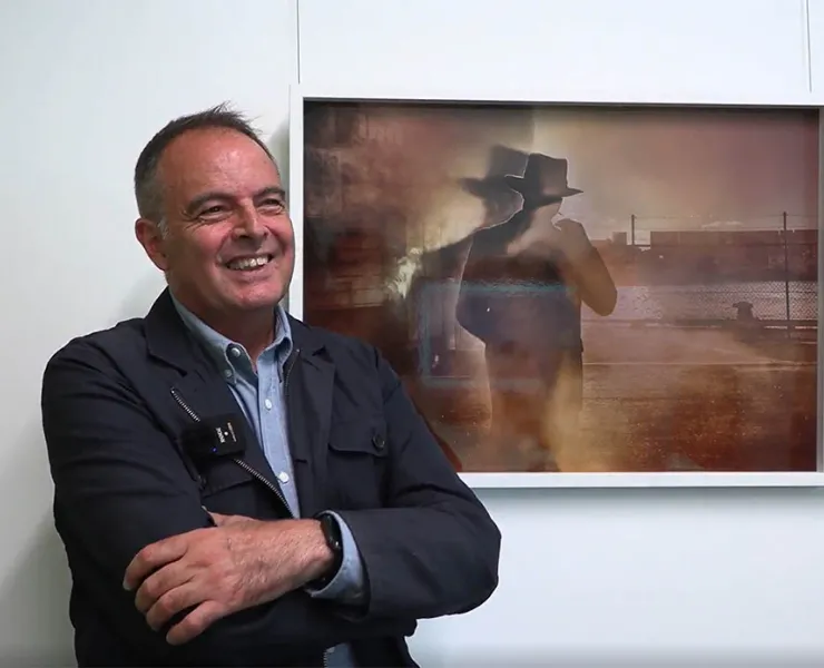 Diego Carpentiero being interviewed in Sydney. Artwork by Tracey Moffat