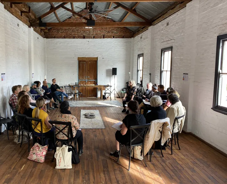 People sitting in a circle at a workshop