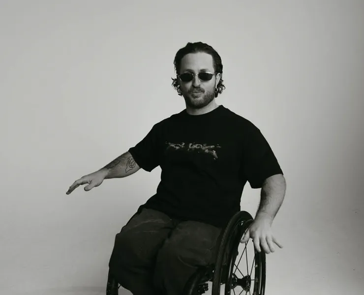 DJ in black clothes and a wheelchair
