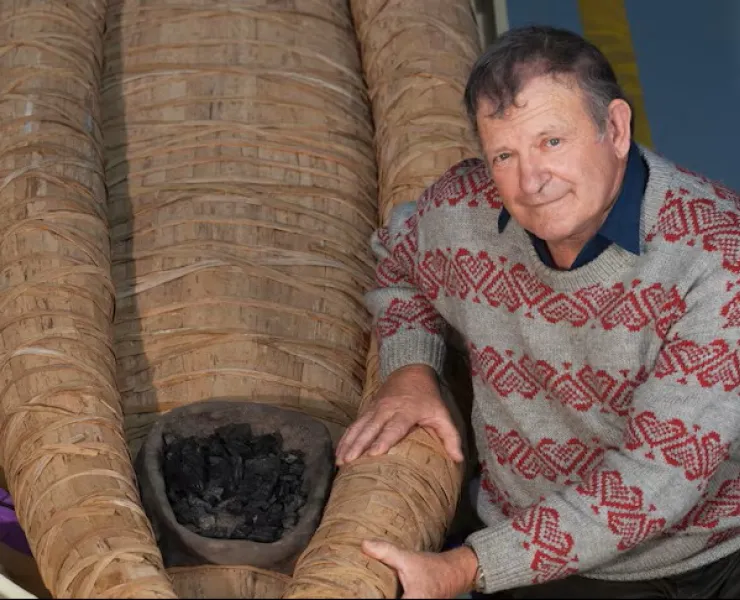 Uncle Rex Greeno with his traditionally made Tasmanian Aboriginal bark canoe