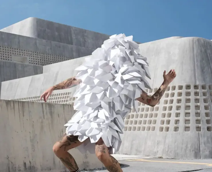 Illustrative. Dancer in white tasselled costume