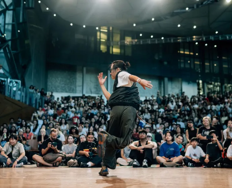 Breakdancer at On&On Festival, performing in front of a captivated audience
