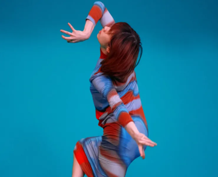 woman dancing on blue background